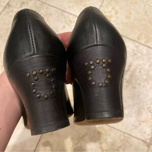 Salvatore Ferragamo black pumps with logo studded heel size 8.5. Like new